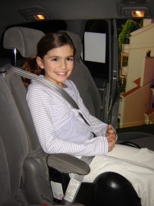 Girl in car booster seat