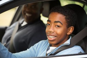 Teen driving a car